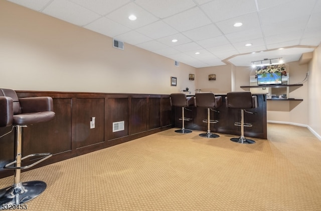 bar featuring light colored carpet