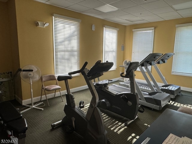 gym featuring a drop ceiling