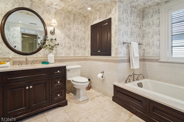 bathroom with toilet, a tub, and vanity