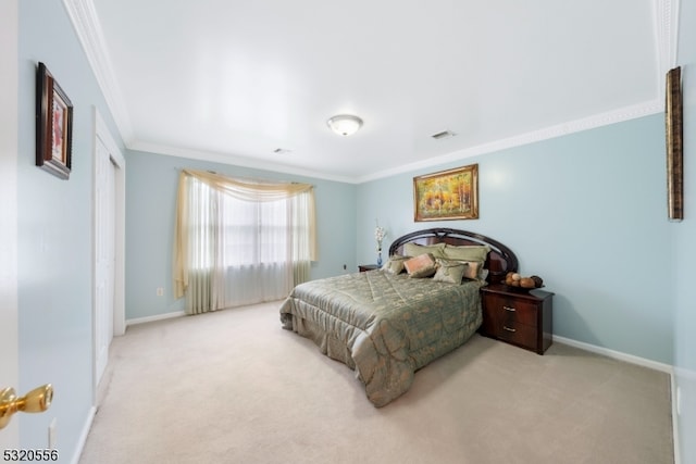 bedroom with light carpet and crown molding