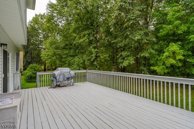 wooden deck featuring area for grilling