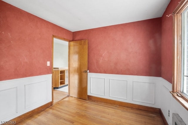 unfurnished room featuring light wood-type flooring