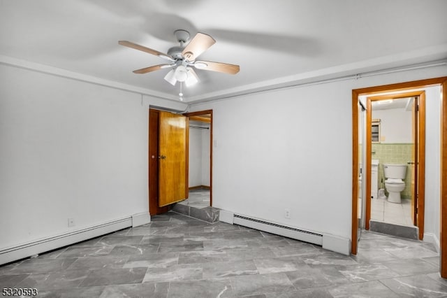 unfurnished bedroom with tile walls, ceiling fan, connected bathroom, and a baseboard heating unit