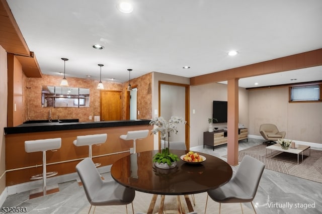 dining area featuring wet bar