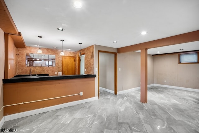 kitchen featuring sink and decorative light fixtures