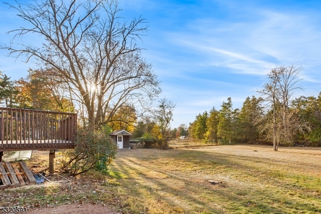 view of yard featuring a wooden deck