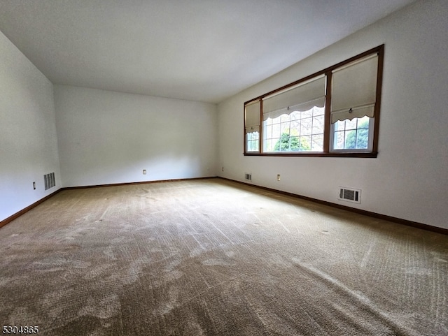 unfurnished room featuring carpet