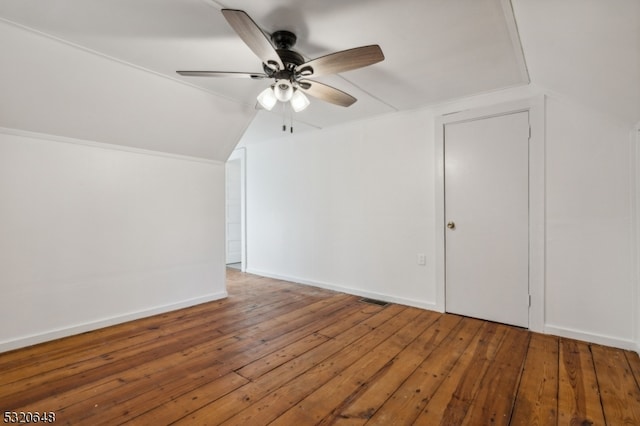 additional living space featuring ceiling fan, vaulted ceiling, and hardwood / wood-style floors