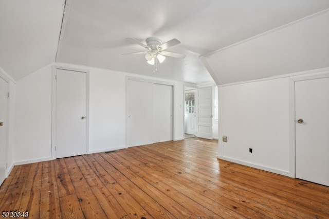 bonus room featuring lofted ceiling, light hardwood / wood-style floors, and ceiling fan