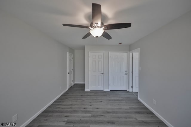 unfurnished bedroom with hardwood / wood-style flooring and ceiling fan