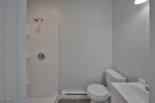 bathroom with toilet, a baseboard heating unit, walk in shower, and vanity