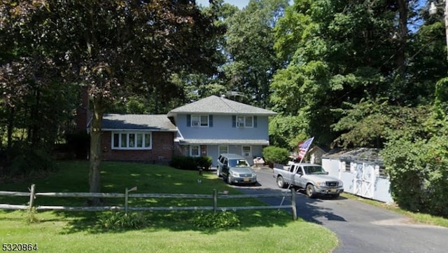 view of front of home with a front yard