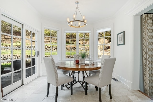 sunroom / solarium featuring a wealth of natural light and a chandelier