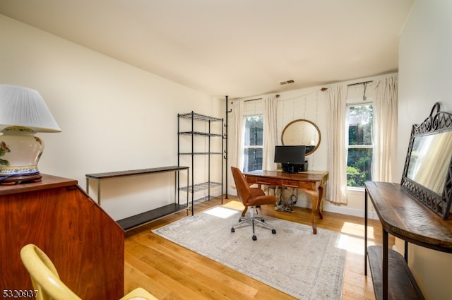 office area with light hardwood / wood-style flooring