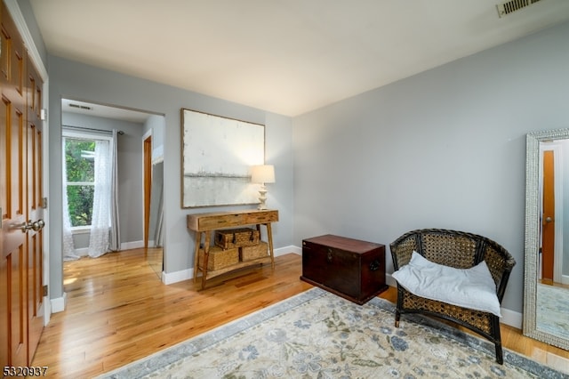 sitting room featuring light hardwood / wood-style flooring