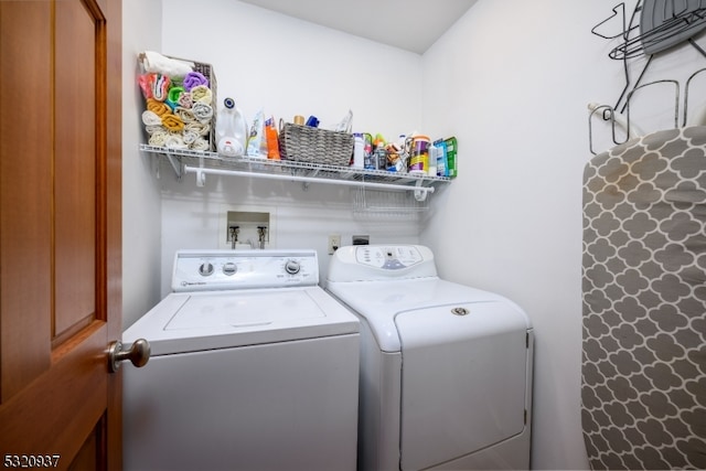 washroom featuring washer and clothes dryer