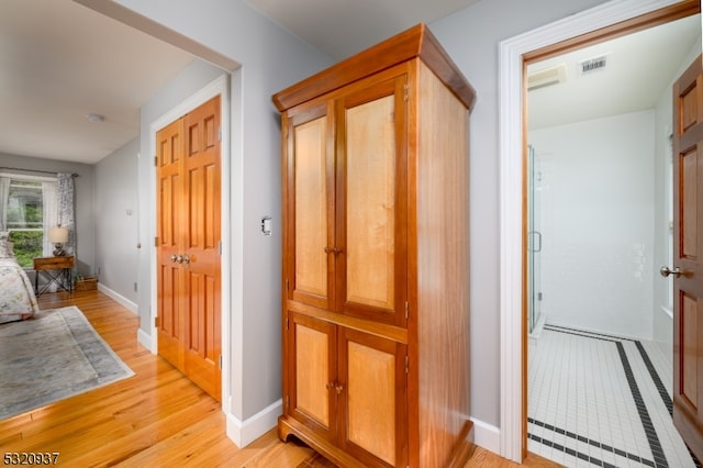 hall featuring light hardwood / wood-style floors