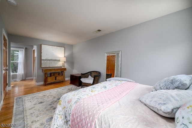 bedroom featuring hardwood / wood-style flooring