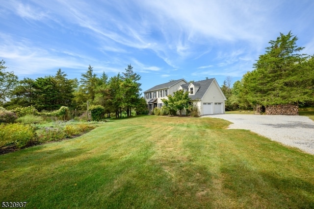 exterior space with a lawn and a garage