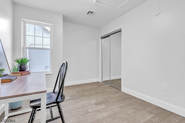 office with light wood-type flooring