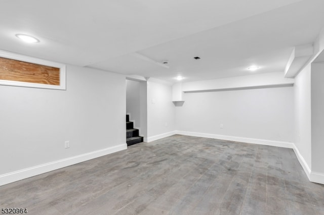 basement featuring hardwood / wood-style flooring