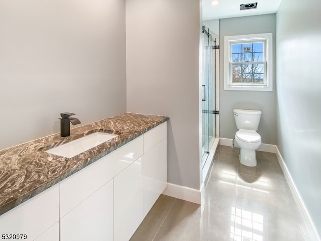 bathroom with toilet, an enclosed shower, vanity, and tile patterned flooring