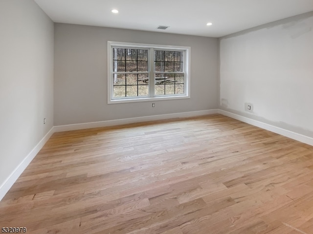 unfurnished room featuring light wood-type flooring