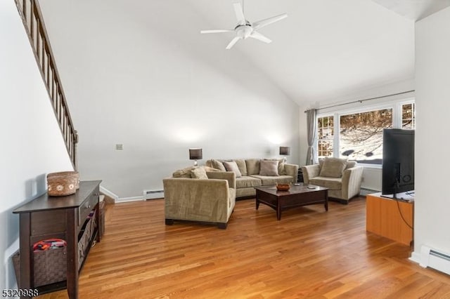 living room with a baseboard radiator, high vaulted ceiling, and light hardwood / wood-style floors