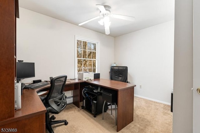 office with a baseboard heating unit, light carpet, and ceiling fan