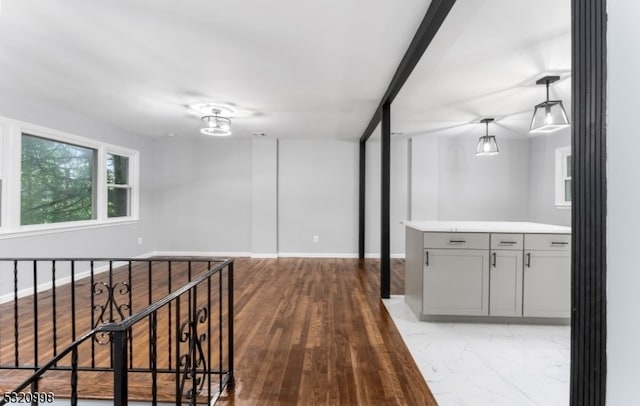 corridor with light hardwood / wood-style floors