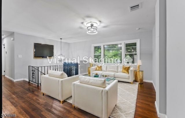 living room with dark hardwood / wood-style flooring