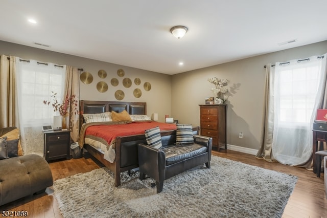 bedroom with wood-type flooring