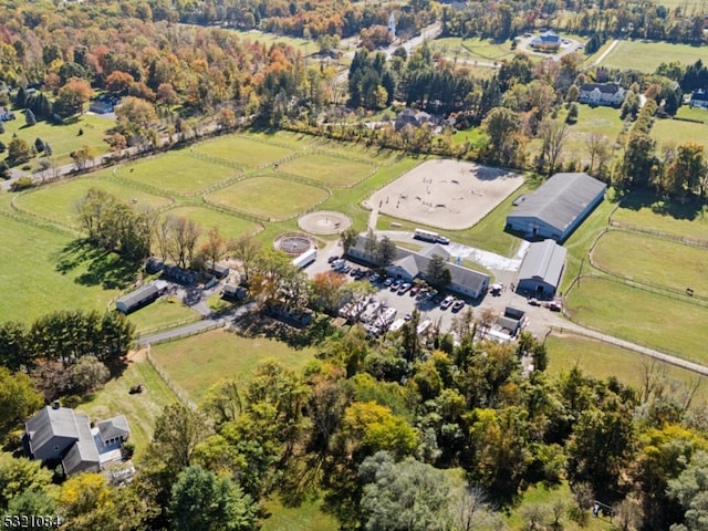 birds eye view of property featuring a rural view