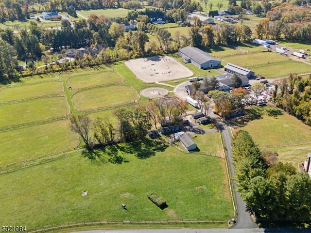 birds eye view of property with a rural view