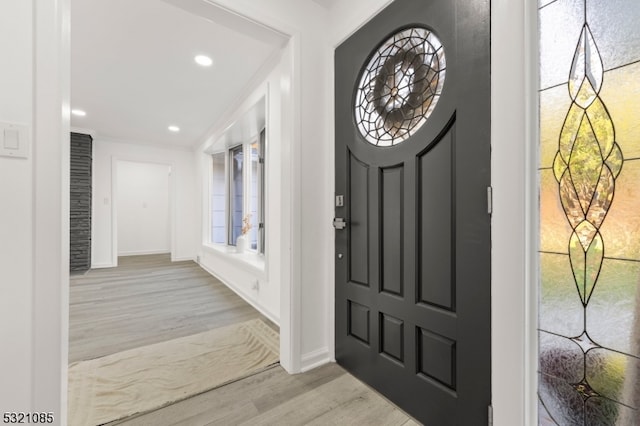 foyer entrance with light hardwood / wood-style floors