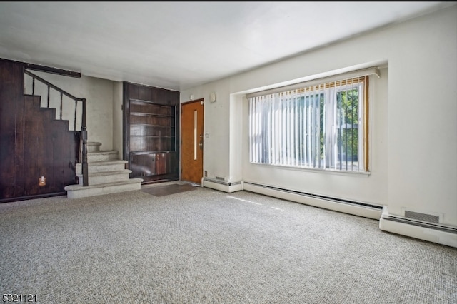 unfurnished living room featuring a baseboard radiator and carpet floors