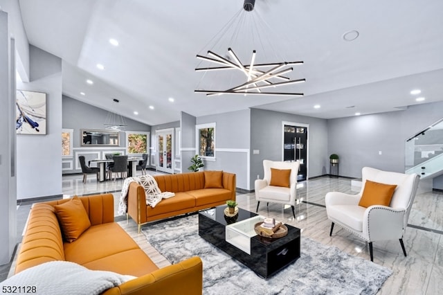 living room featuring a notable chandelier and lofted ceiling