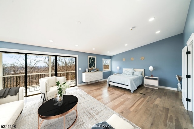 bedroom featuring hardwood / wood-style flooring and access to exterior