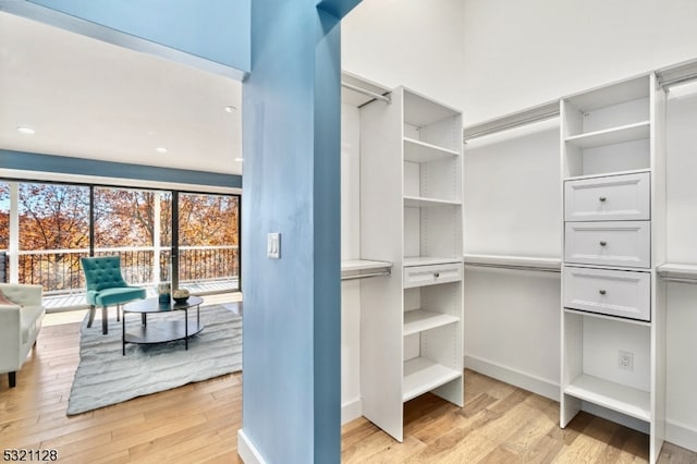 walk in closet featuring light wood-type flooring