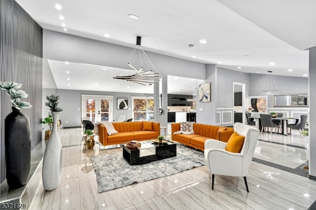 living room featuring an inviting chandelier