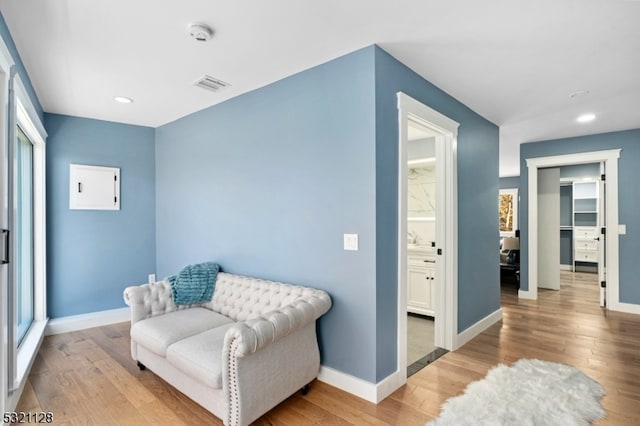 living area featuring hardwood / wood-style floors and a wealth of natural light