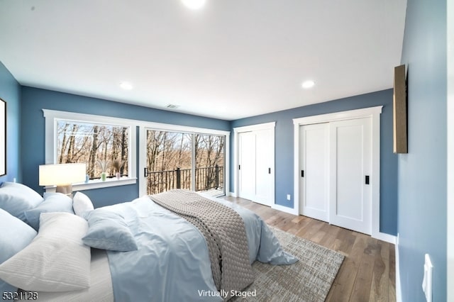 bedroom featuring hardwood / wood-style floors and access to outside