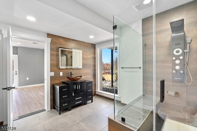 bathroom featuring vanity, tile patterned flooring, and an enclosed shower