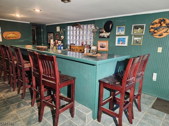 bar featuring crown molding