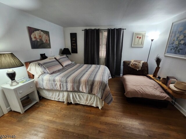 bedroom featuring hardwood / wood-style floors