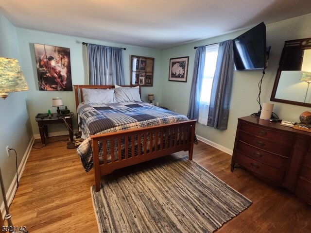 bedroom featuring light hardwood / wood-style floors