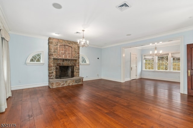 unfurnished living room featuring a notable chandelier, dark hardwood / wood-style floors, a stone fireplace, and ornamental molding