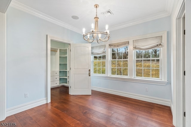 unfurnished dining area featuring a notable chandelier, dark hardwood / wood-style flooring, and crown molding