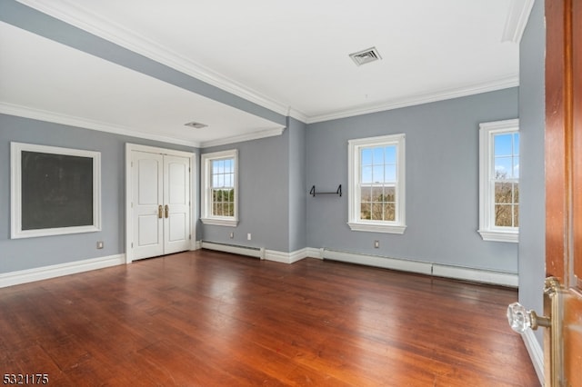 unfurnished bedroom with multiple windows, baseboard heating, and dark wood-type flooring