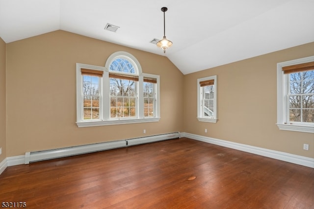 unfurnished room with lofted ceiling, dark hardwood / wood-style floors, and a baseboard heating unit